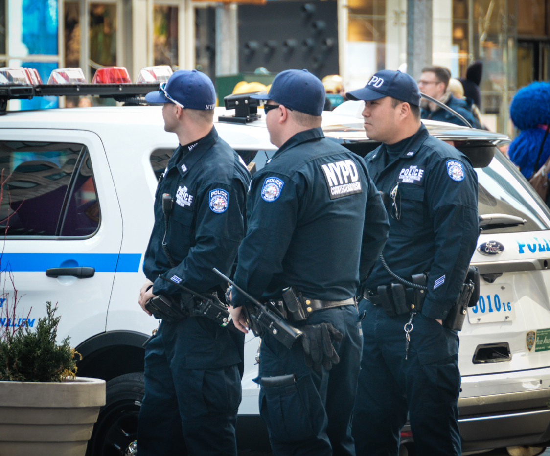 group of NYC armed security guards clearing the streets