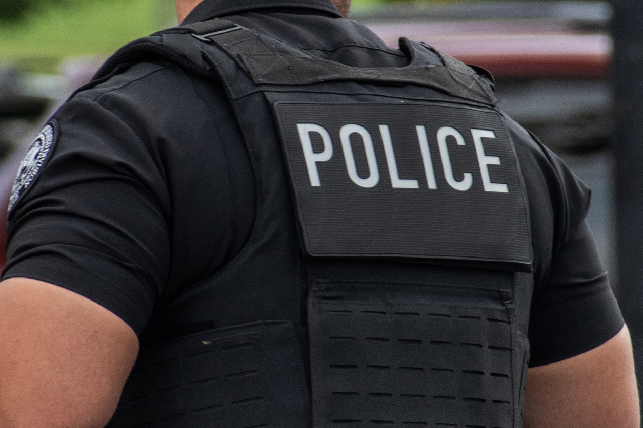 Police inscription on the back of an officer